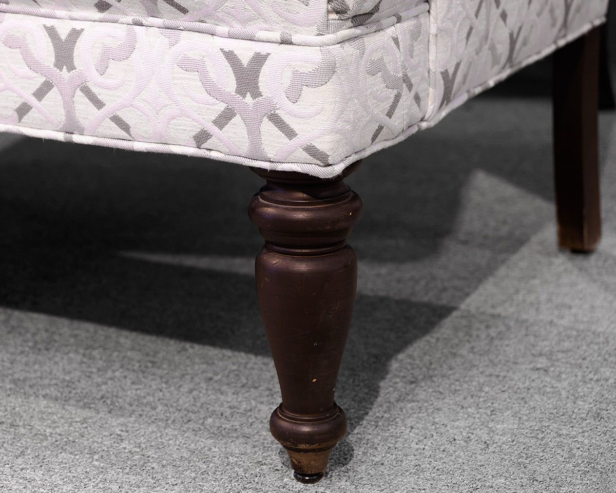 Upholstered Settee with Rolled Arms and Turned Legs