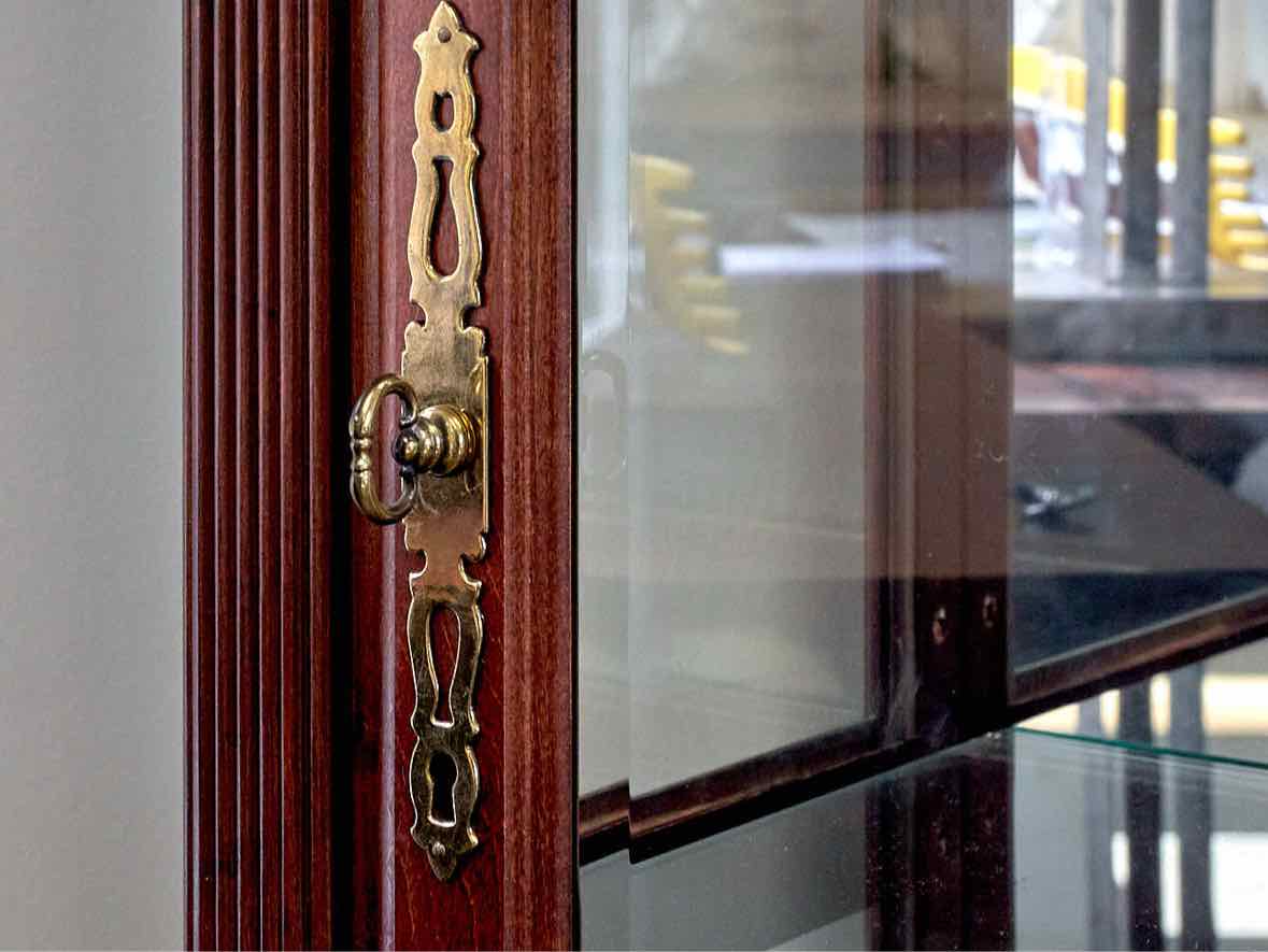 Howard Miller Cherry & Glass Curio Cabinet