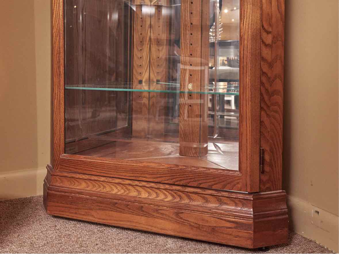 Howard Miller Oak Corner Display Curio Cabinet