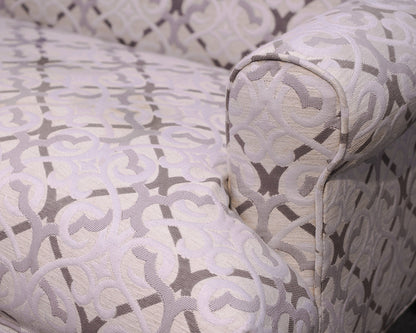 Upholstered Settee with Rolled Arms and Turned Legs